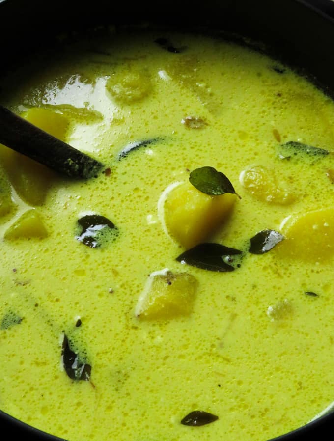 adding coconut milk for the potato curry.