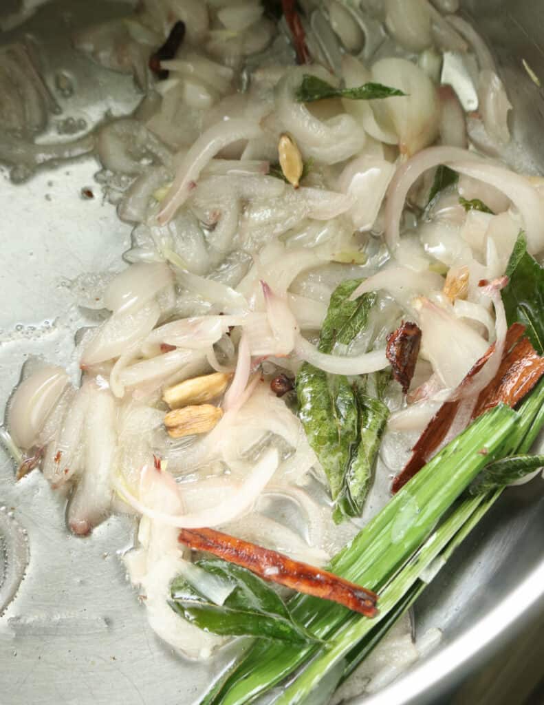 tempering onions to make yellow rice