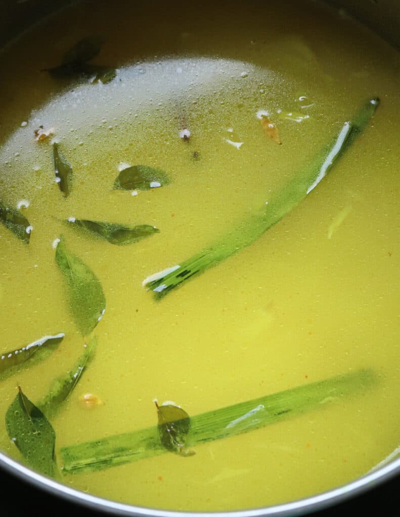water added to cook the turmeric rice with pandan and curry leaves.