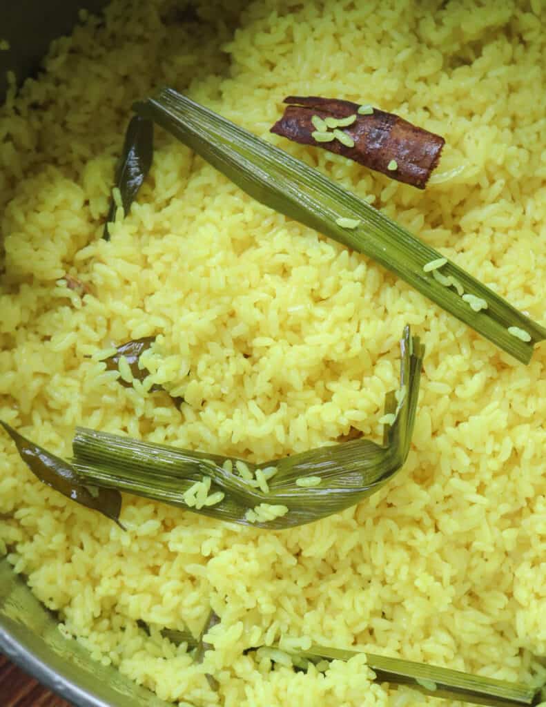 cooked Sri lankan rice with pandan leaves and curry leaves.