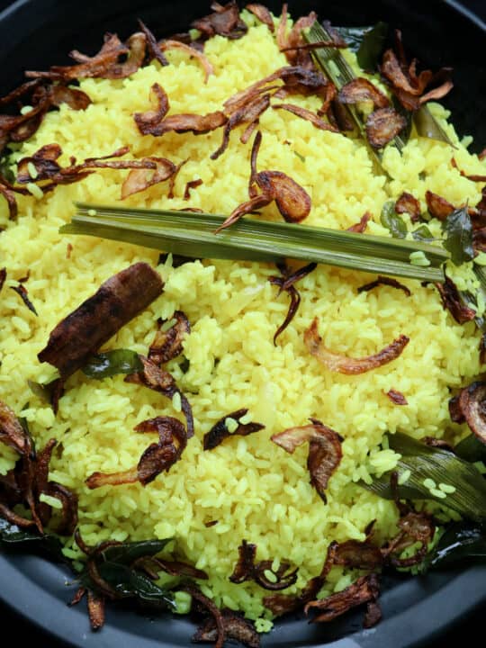 Sri lankan yellow rice or turmeric rice served on a plate