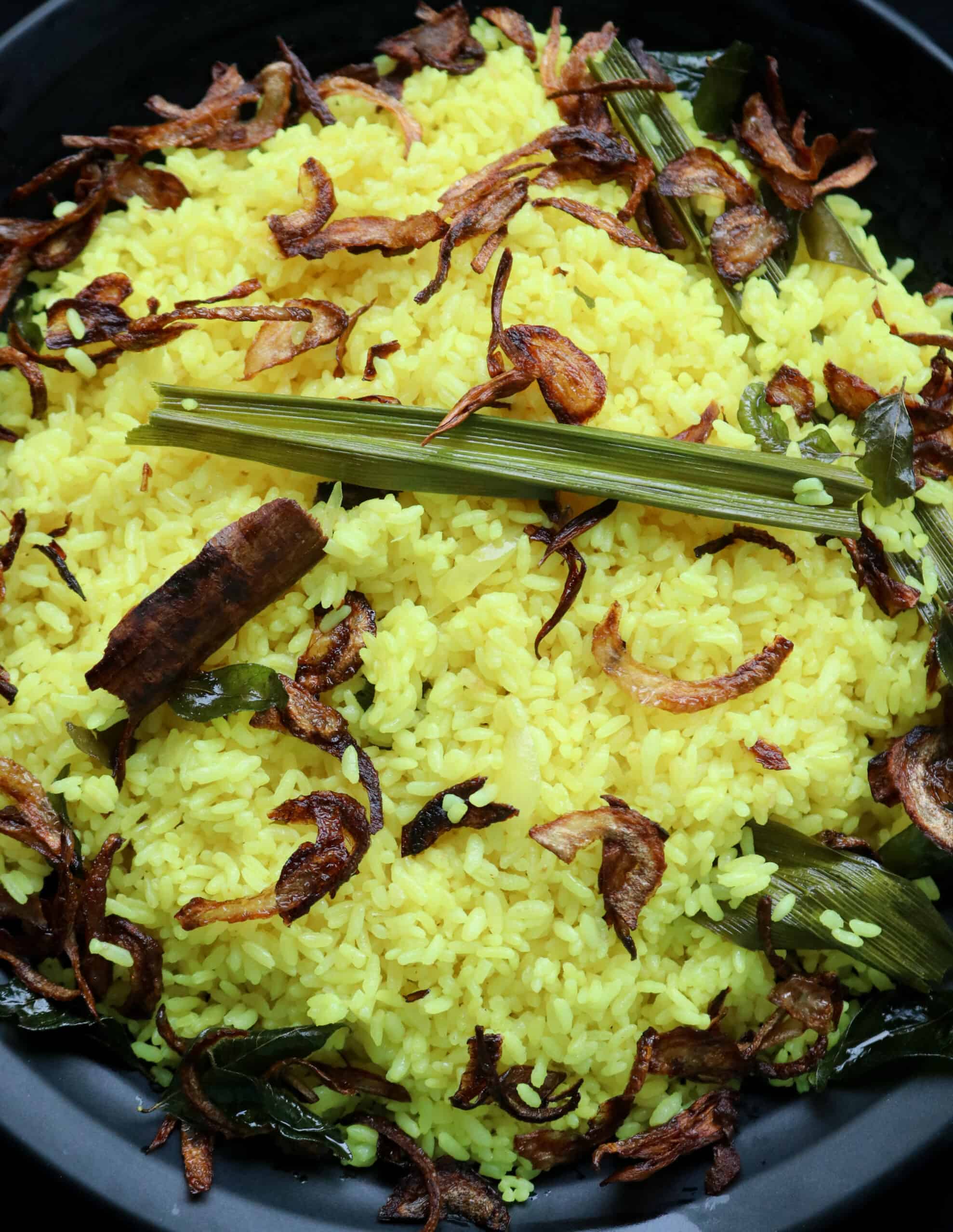 Sri lankan yellow rice or turmeric rice served on a plate