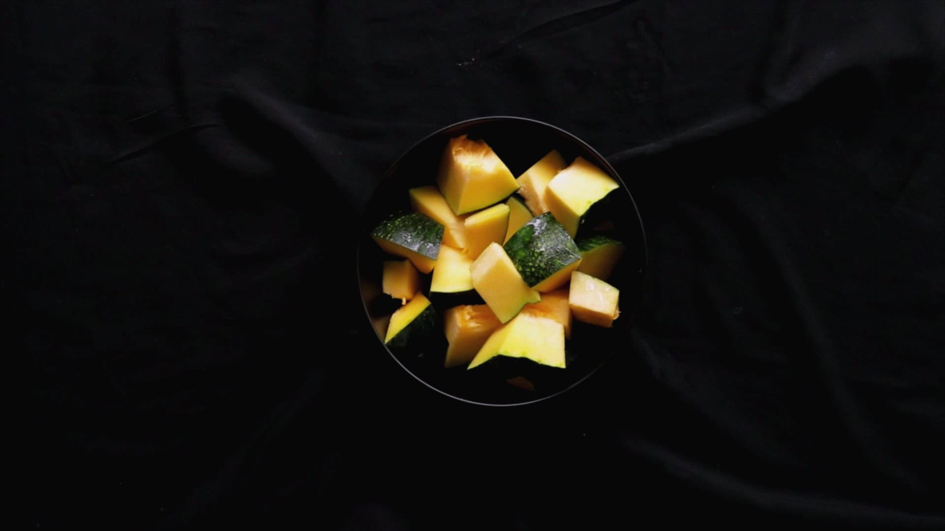 pumpkin cut into cubes ready to be cooked for pumpkin curry.