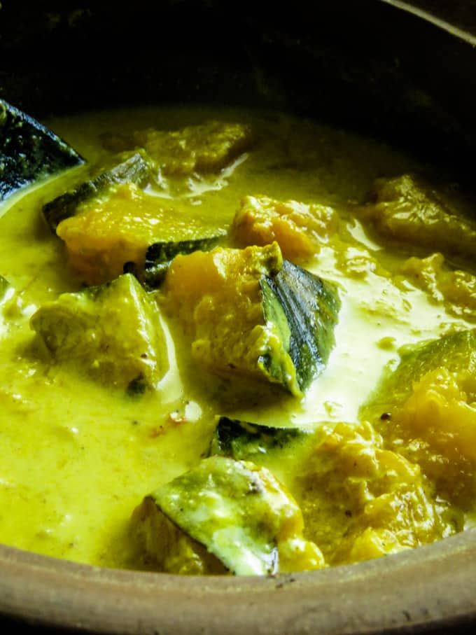 cooking the pumpkin in coconut milk.