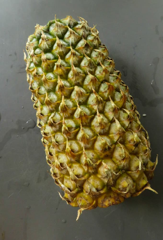 whole pineapple ready to be cleaned to a pineapple chutney.