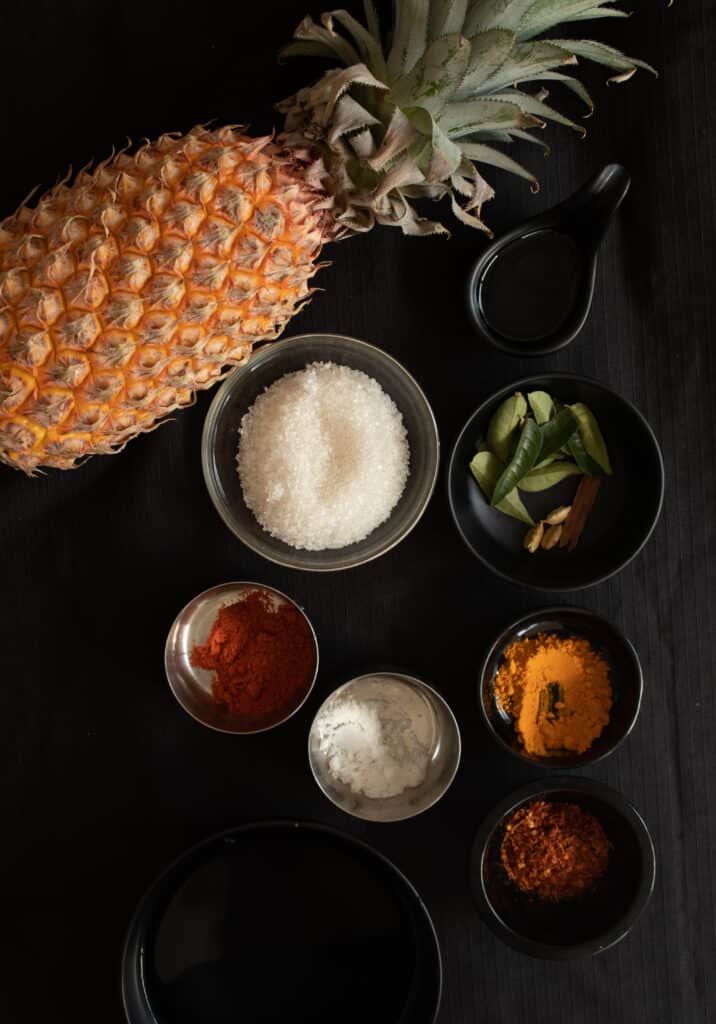 whole pineapple and other ingredients to make the pineapple chutney.