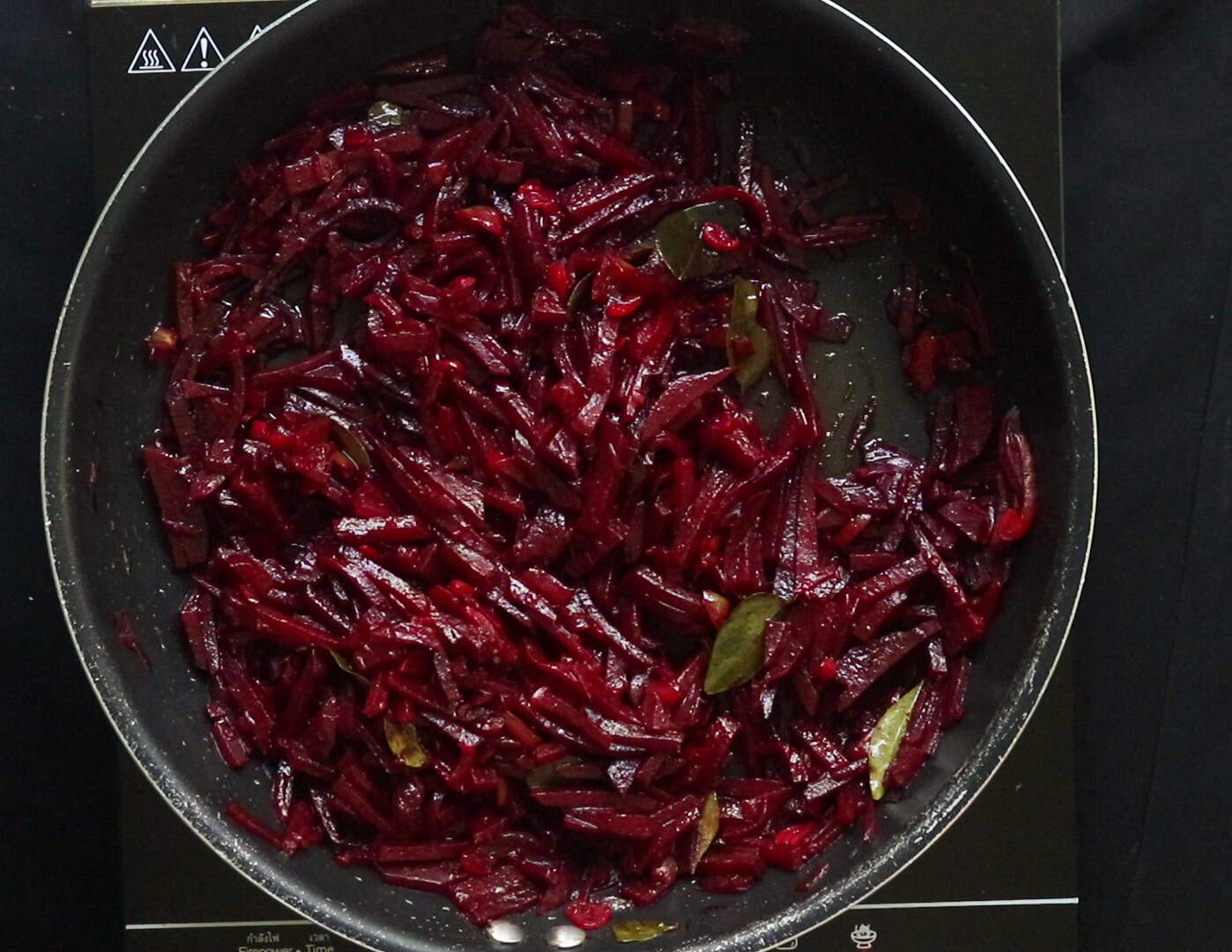 cooking the beetroot with oil for a few minutes.