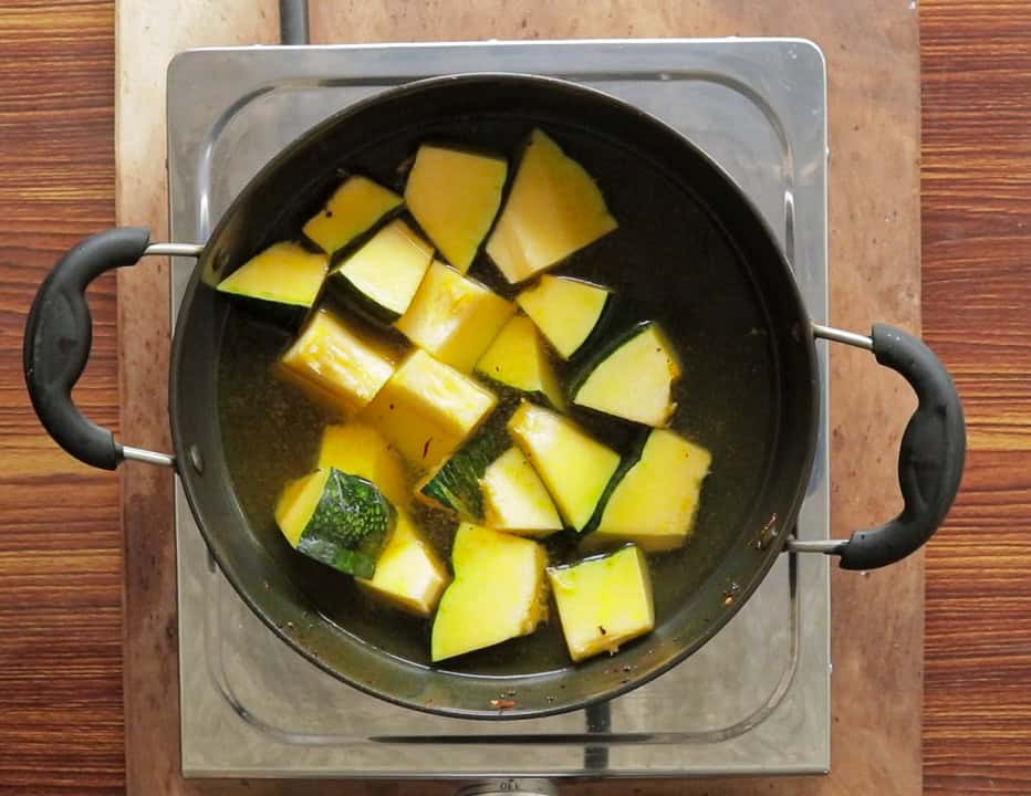 pumpkin cubes placed in a cooking pan to cook.