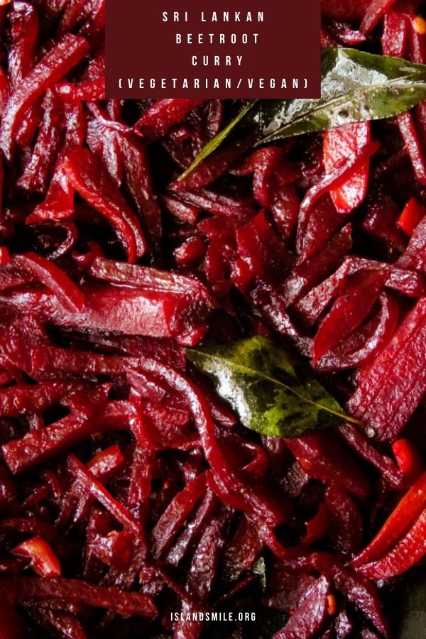 a close up of Sri Lankan beet root curry with curry leaves and spices.