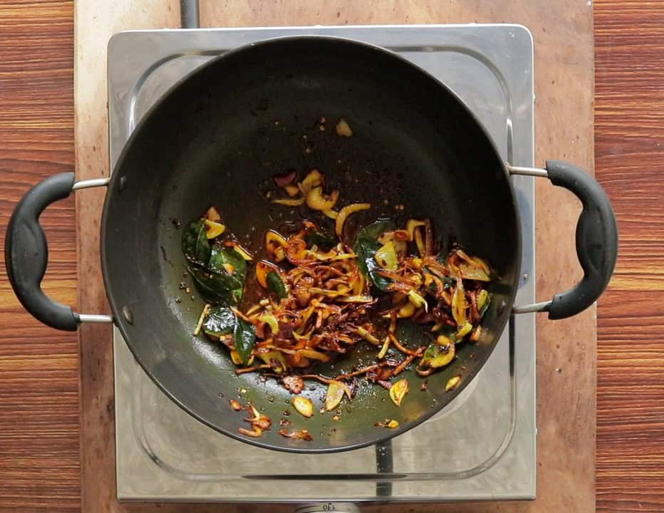 tempered curry leaves, onions, garlic and spices until they turn golden in color.