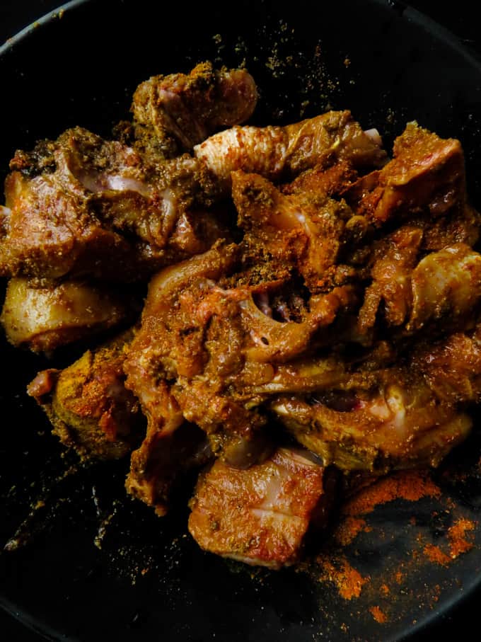 marinated bowl of chicken with spices sri lankan style.