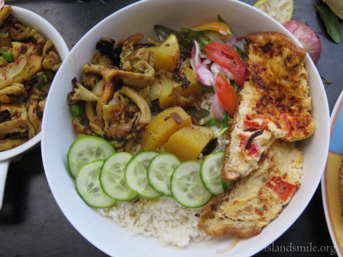 rice, stirfried mushrooms,spring onion salad, cucumbers, potatoes cooked in coconut milk and spicy omelette