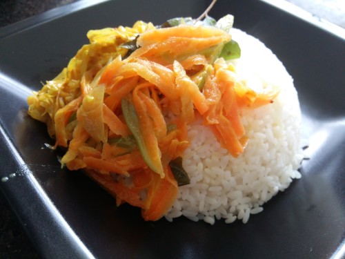 rice, a tangy paprika salad, beans and carrots cooked in coconut milk, cabbage stir fry and a crispy pepper beef curry.