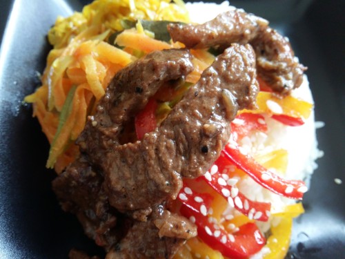 rice, a tangy paprika salad, beans and carrots cooked in coconut milk, cabbage stir fry and a crispy pepper beef curry.