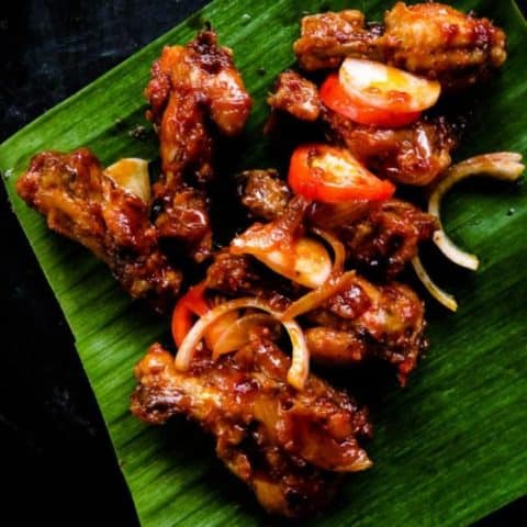 Pan-fried spicy chicken wings. Also known as Sri Lankan devil wings. It takes minutes to marinate and lock in flavors. A perfect appetizer in a rush that you could put together with a few ingredients. finger food for game nights, and parties.