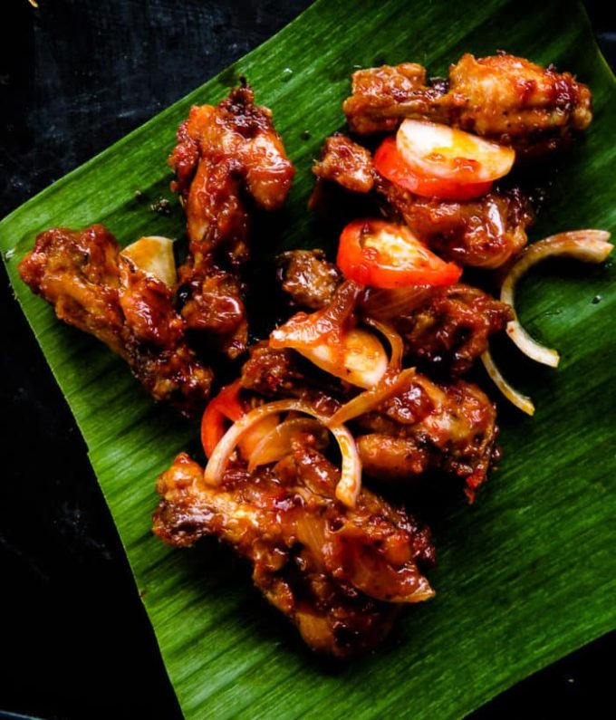 Pan-fried spicy chicken wings. Also known as Sri Lankan devil wings. It takes minutes to marinate and lock in flavors. A perfect appetizer in a rush that you could put together with a few ingredients. finger food for game nights, and parties.