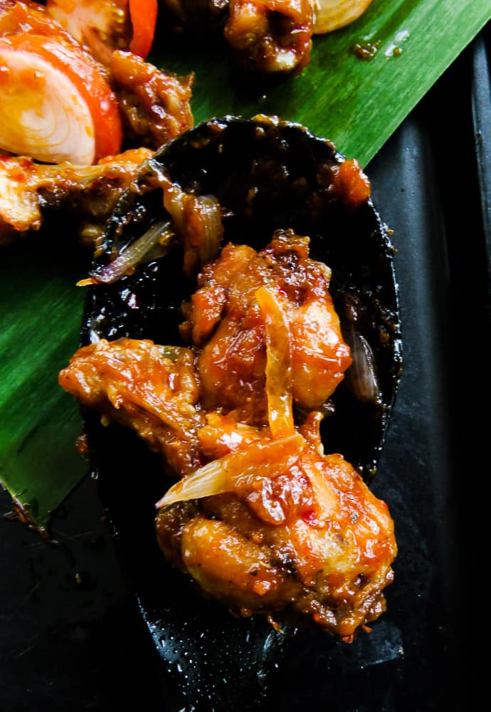 Pan-fried spicy chicken wings. Also known as Sri Lankan devil wings. It takes minutes to marinate and lock in flavors. A perfect appetizer in a rush that you could put together with a few ingredients. finger food for game nights, and parties.