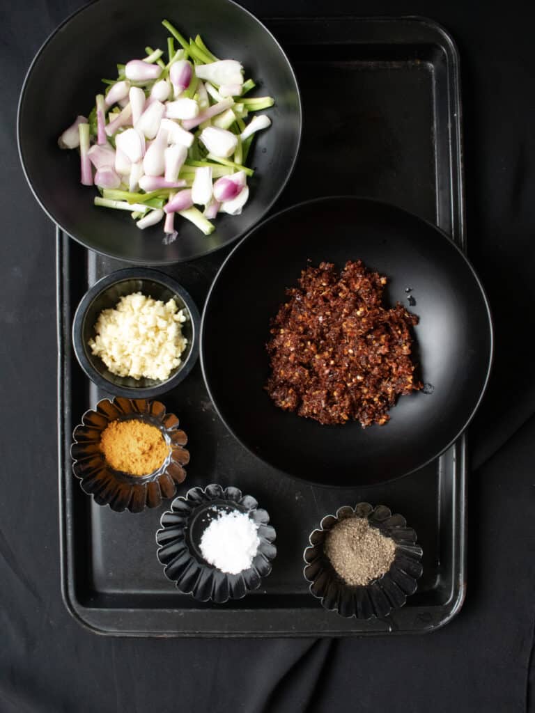 cutting the cuttlefish to make the hot butter cuttlefish recipe.