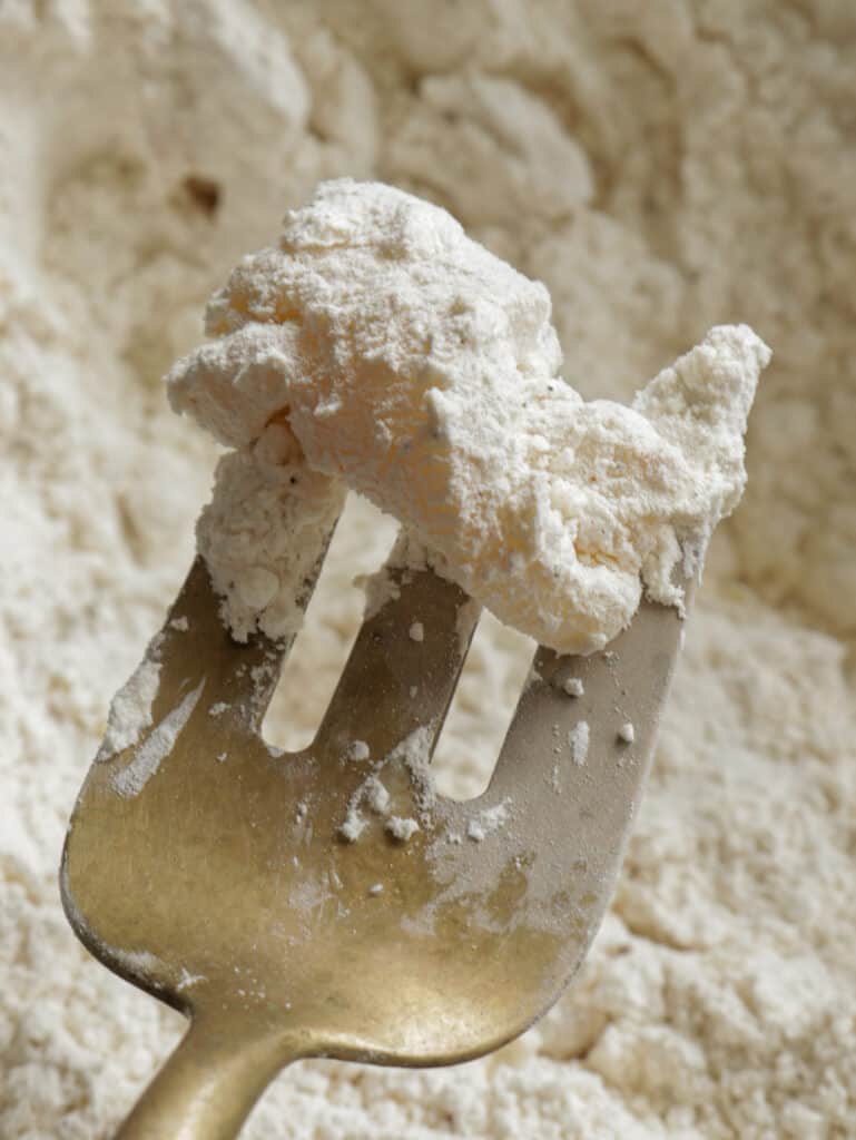 cuttlefish covered in seasoned flour to fry.