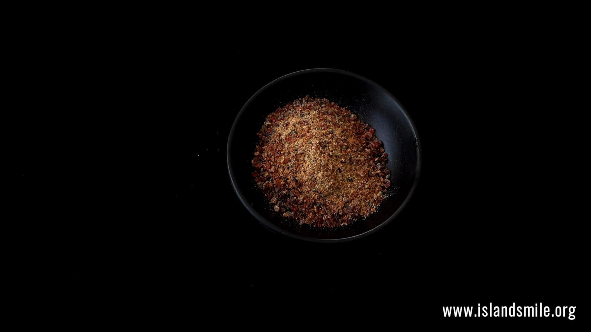 pounding the maldive fish for the coconut sambol.