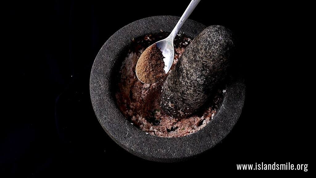 adding the maldive fish powder to make the pol sambol.