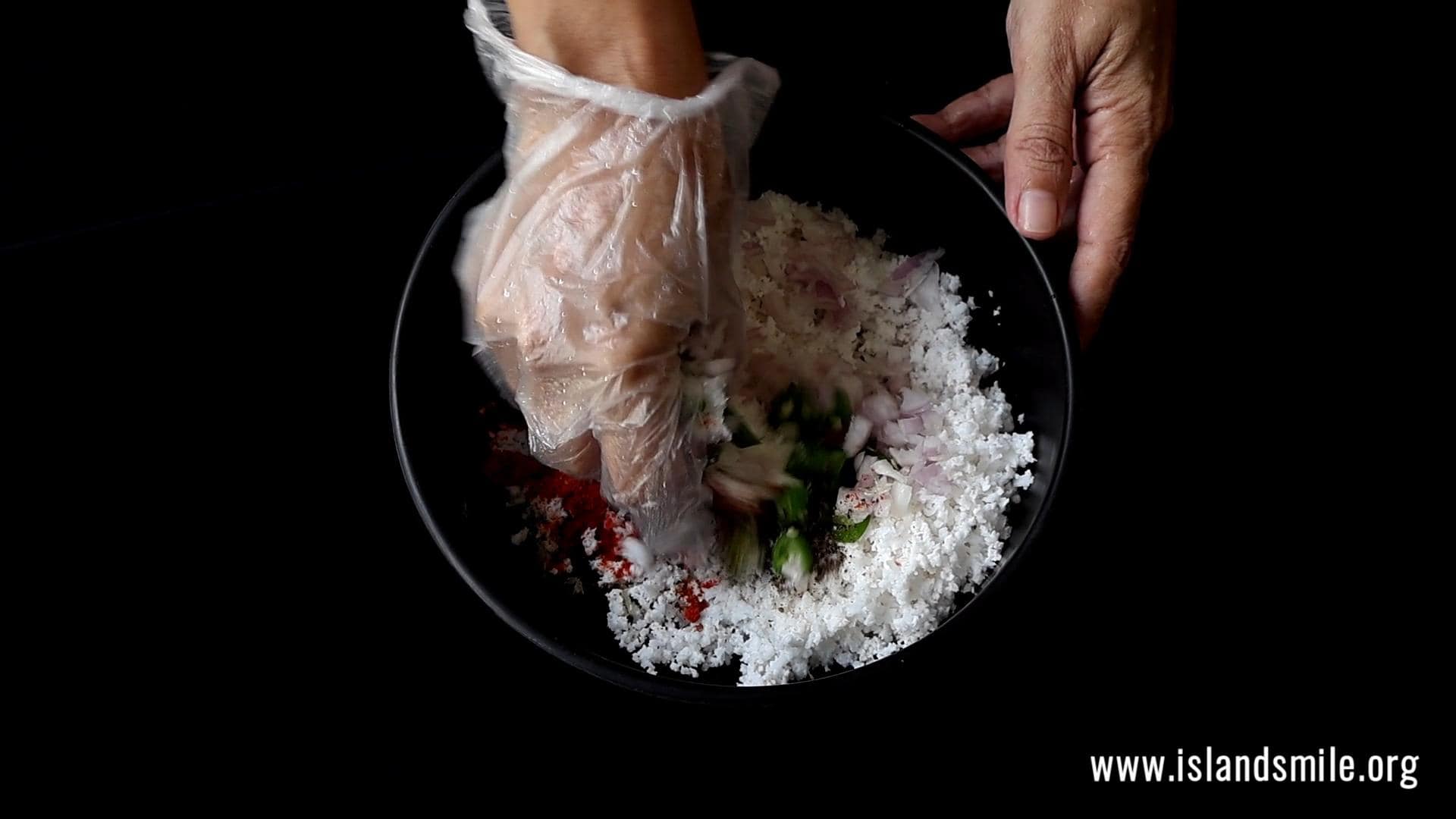 combining all the ingredients by hand.