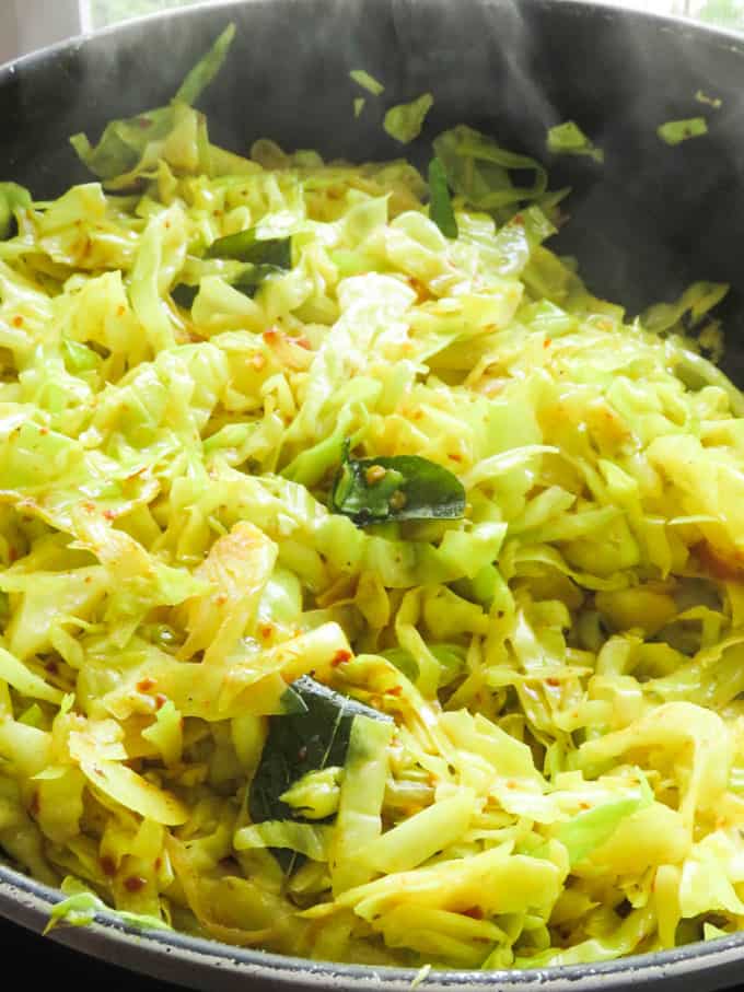Cabbage fry cooking in a pan.