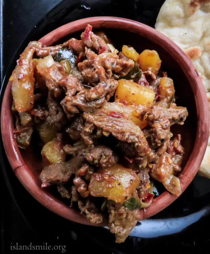 Sri Lankan spicy beef and potato keema curry. It makes a great filling for samosas, empanadas and meaty side-dish for your bread, parathas and naan. With Sri Lankan spices this shredded beef dish is a must try