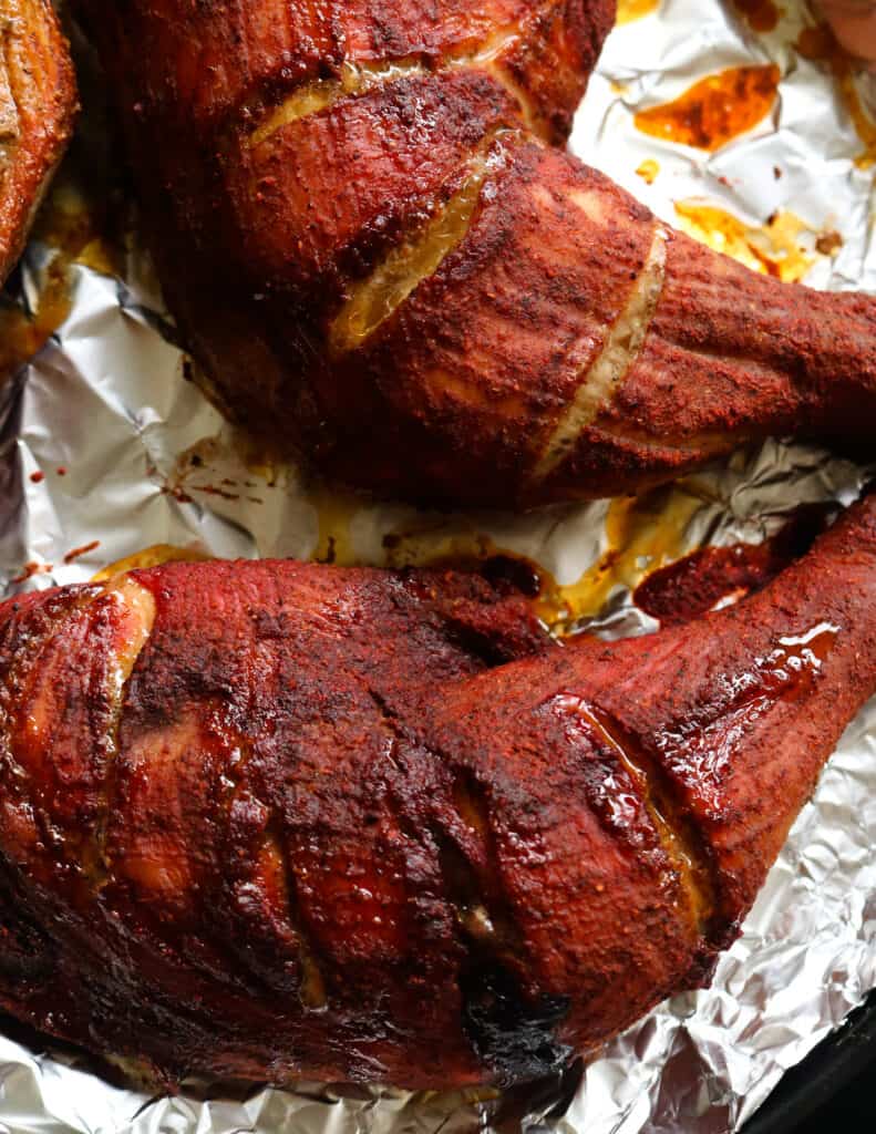 baked tandoori chicken quarters placed in foil