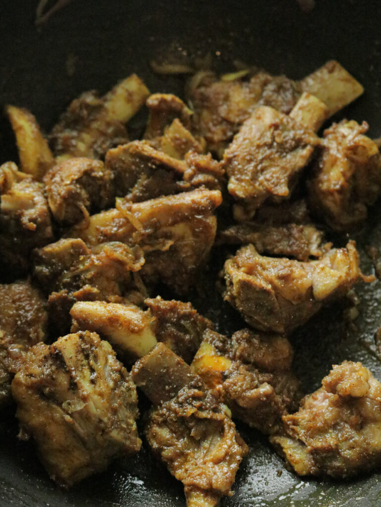 braising the beef bones with spices to make the beef bone soup.