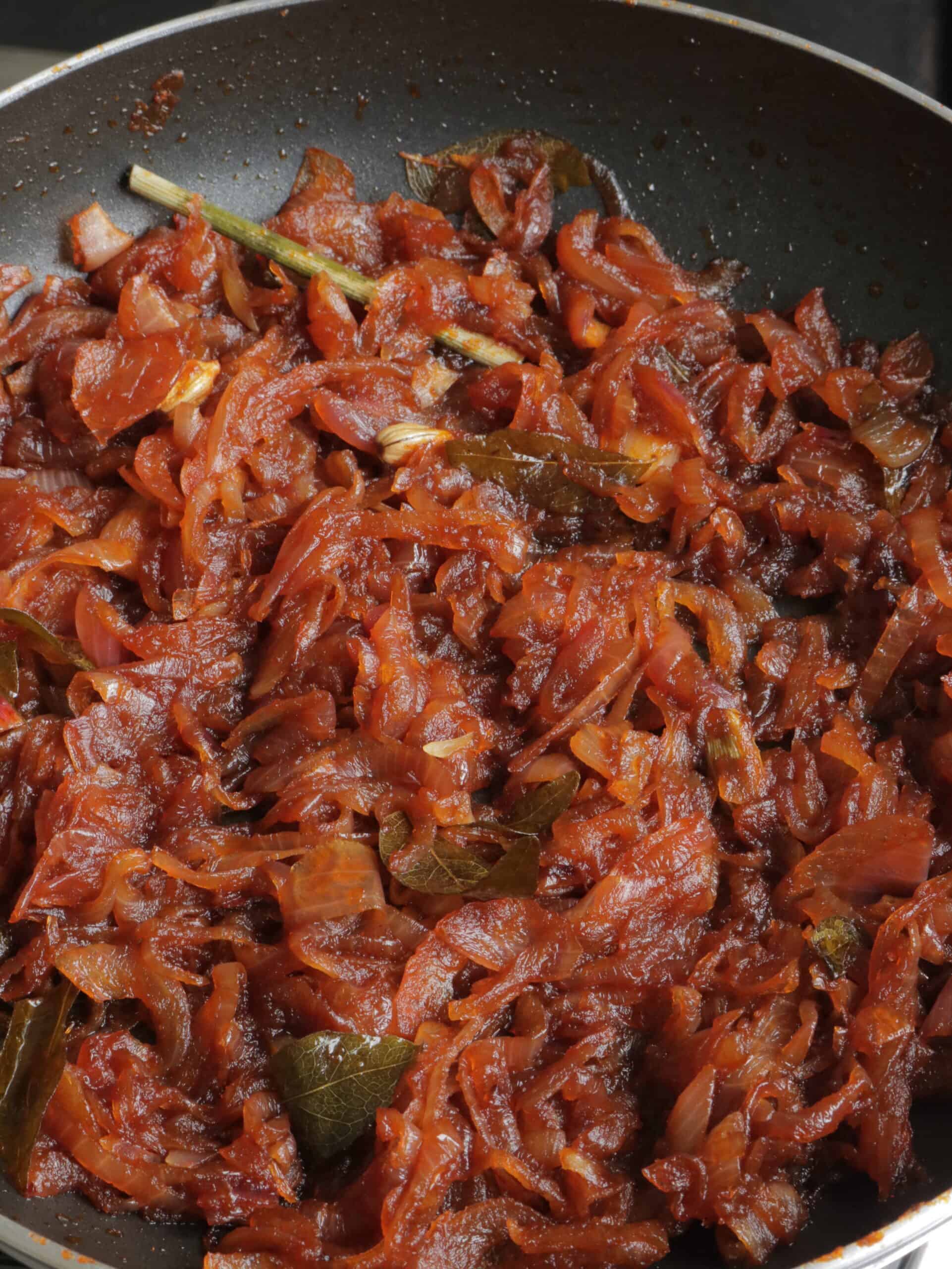seeni sambol cooked with aromatic spices to make the a sweet and spicy relish.