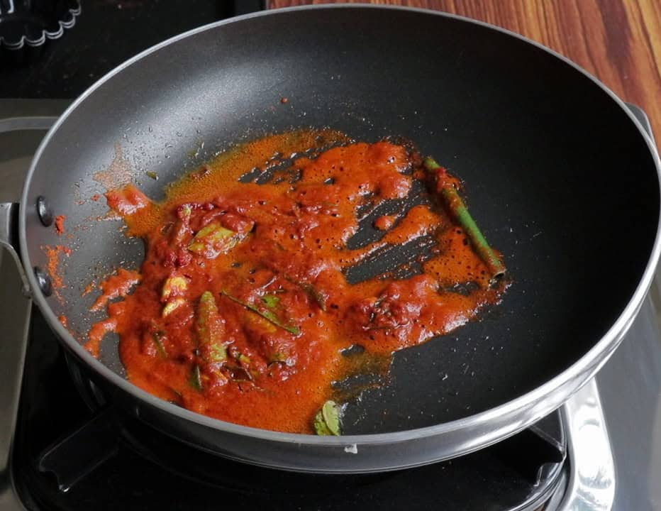 cookking the spices and red chilli powder to make the seeni sambol.