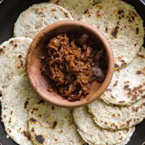 Sri Lankan Coconut roti(pol roti, flatbread). A rustic flatbread made up of flour, grated coconut with diced green chillies and Onions for extra texture. vegan, vegetarian, Sri Lankan breakfast-islandsmile.org