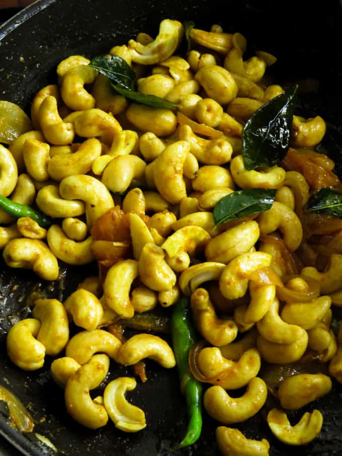 stir fried cashews for the kaju curry.