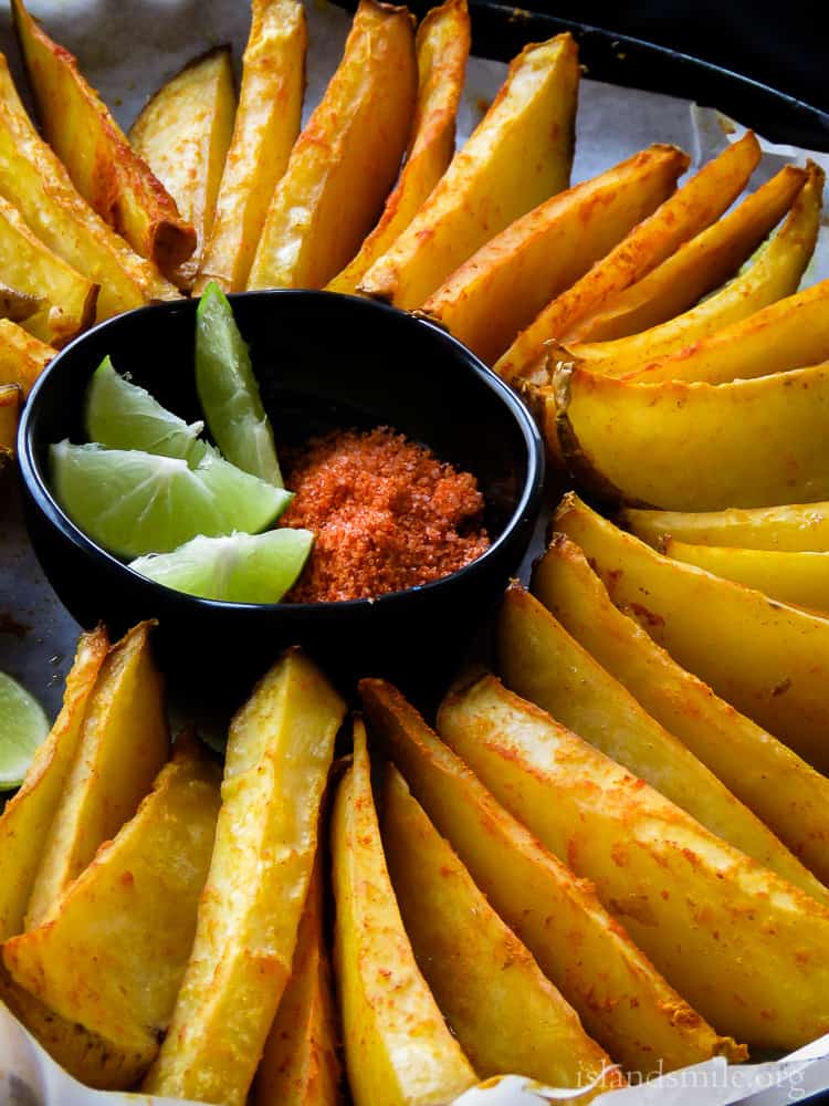 Crunchy on the outside, soft on the inside and spiced up with turmeric, chilli powder is how I'll describe these oven-baked potato wedges.