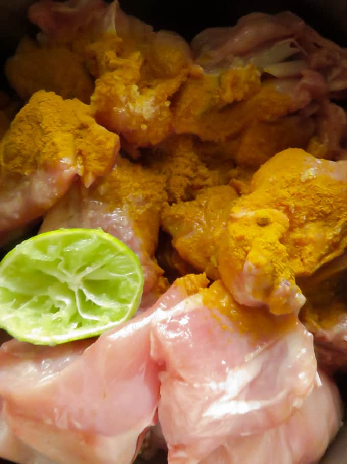 chicken marinated with turmeric,salt and lime juice to make chicken chukka(sukka).