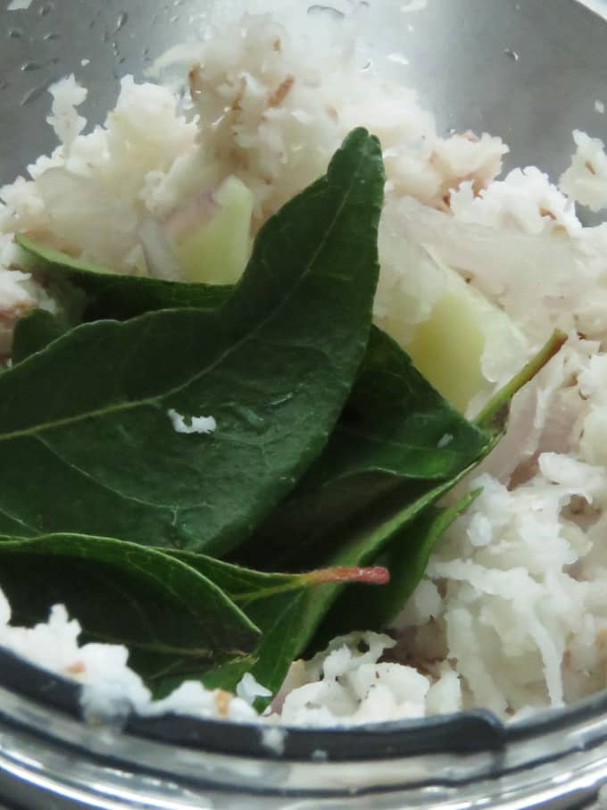 grinding onion, garlic,grated coconut and curry leaves.