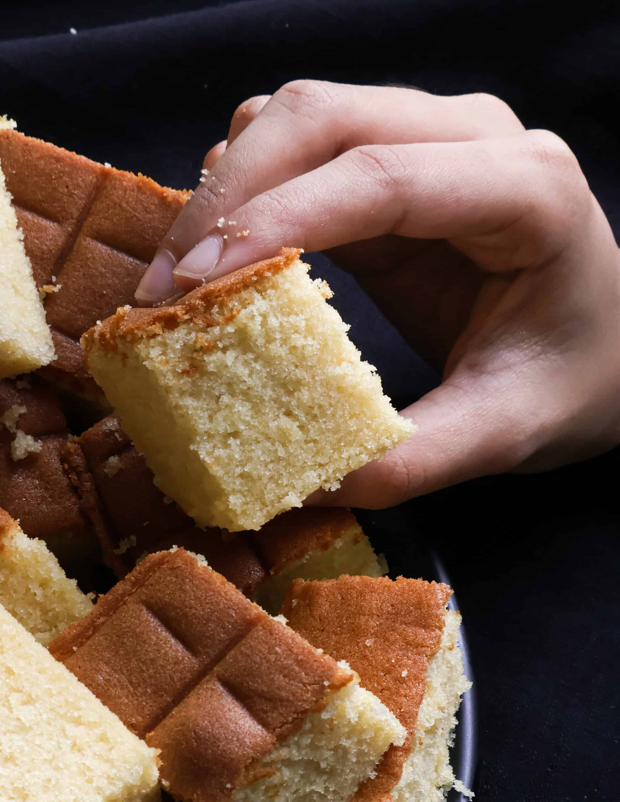 Sri Lankan butter cake held in a hand.