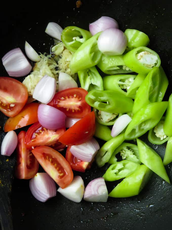 Stir-frying ingredients for devil chicken.