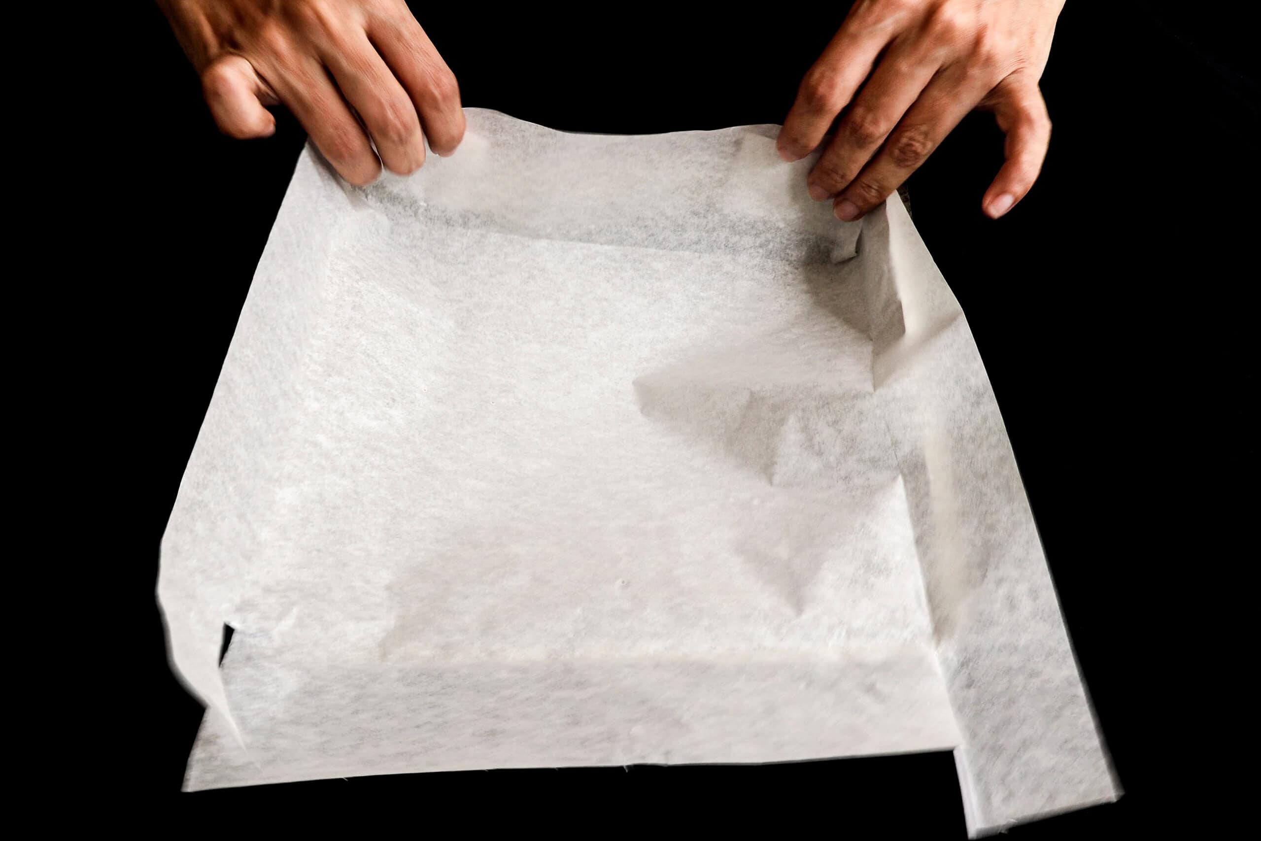 inserting the baking pan into a baking pan.