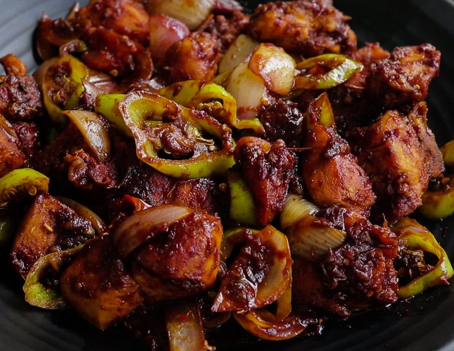 devilled chicken cooked in a spicy sauce with onion wedges and peppers.