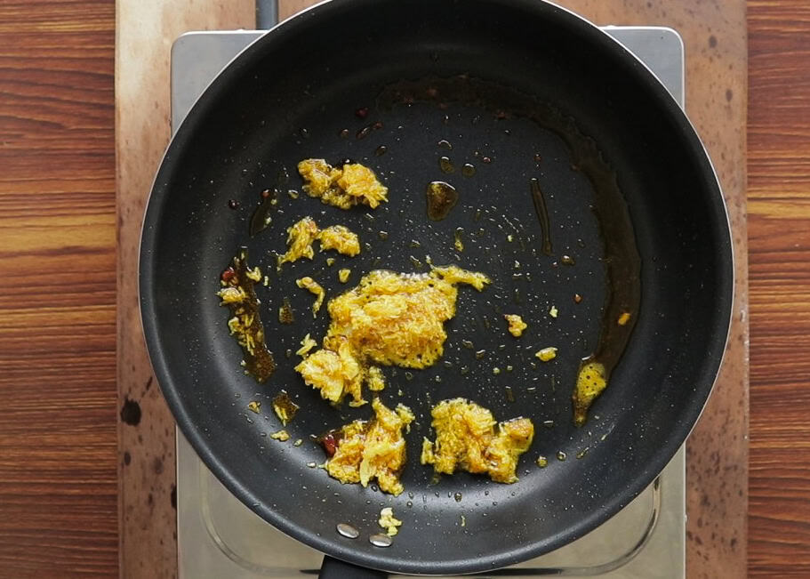 minced garlic and ginger fried to make devilled chicken.