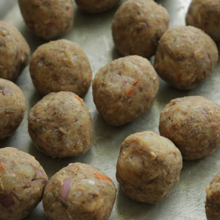 Shaping the fish cutlets into small balls.