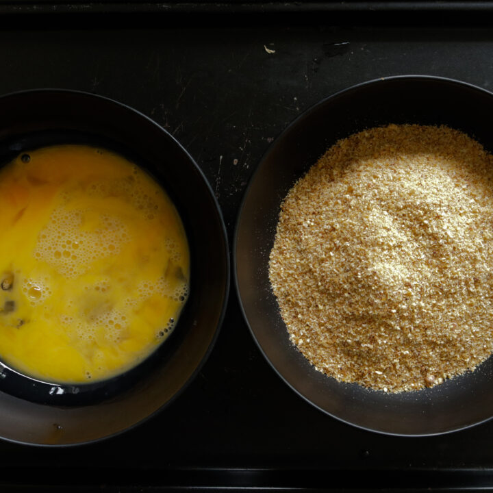 egg and breadcrumbs set to bread and coat the fish cutlets.