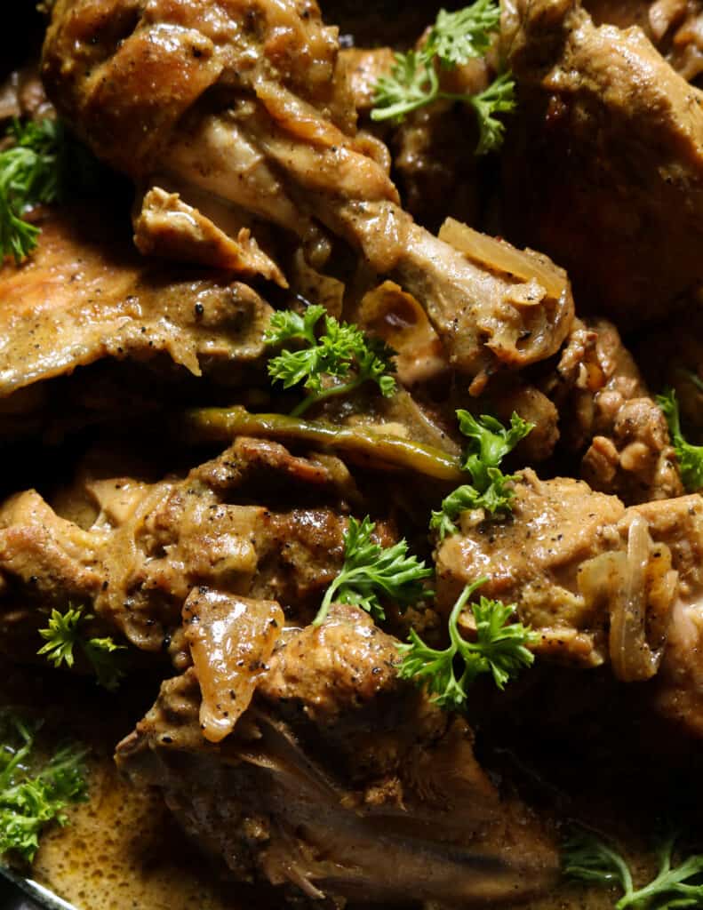 black pepper chicken curry in a bowl.