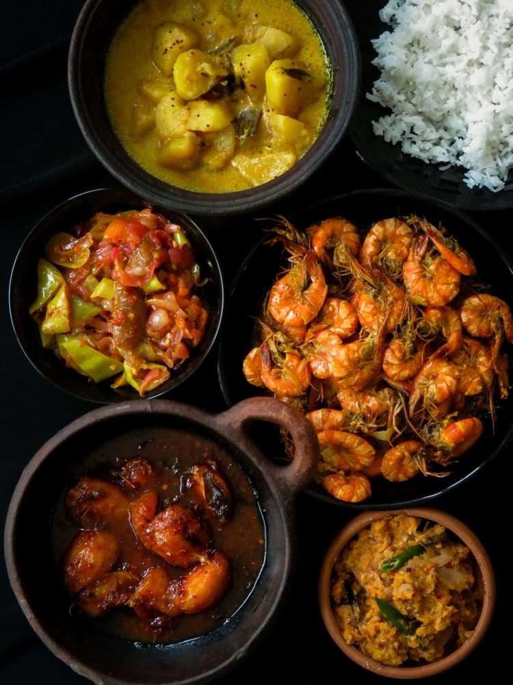 Sri Lankan meal plan 2- Rice with a prawn curry cooked in coconut milk, tempered-dry spicy dhal, capsicum with pickled lime sambol, a creamy potato milk curry and a sweet and spicy ambarella curry makes up this five dish menu.-islandsmile.org