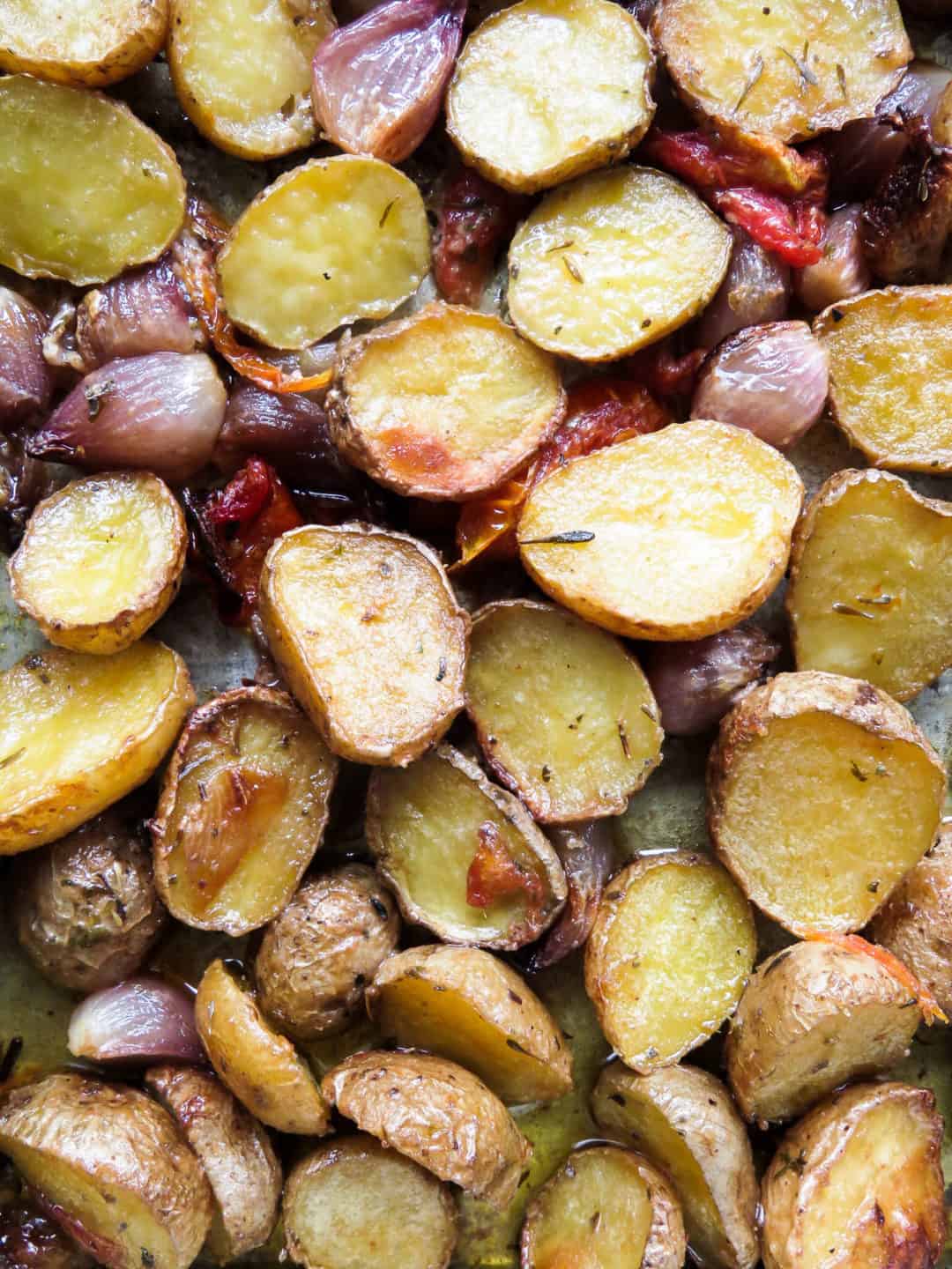 Baked baby potatoes-shallots with mixed herbs, the perfect bite-size dish for any meal, not too much or too little, you can serve within your calory limit and not feel guilty of indulging in carbs-islandsmile.org