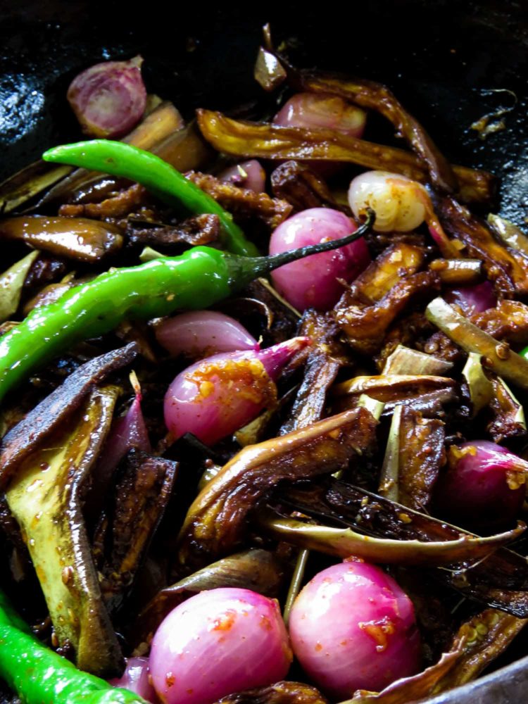 Sri Lankan eggplant dish.  fried eggplant, shallots, green chillies mixed with mustard-vinegar to pickle the vegetables, 