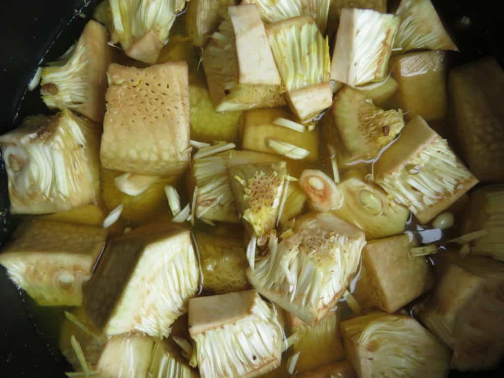 the cleaned baby jackfruit placed in water to avoid discoloration.