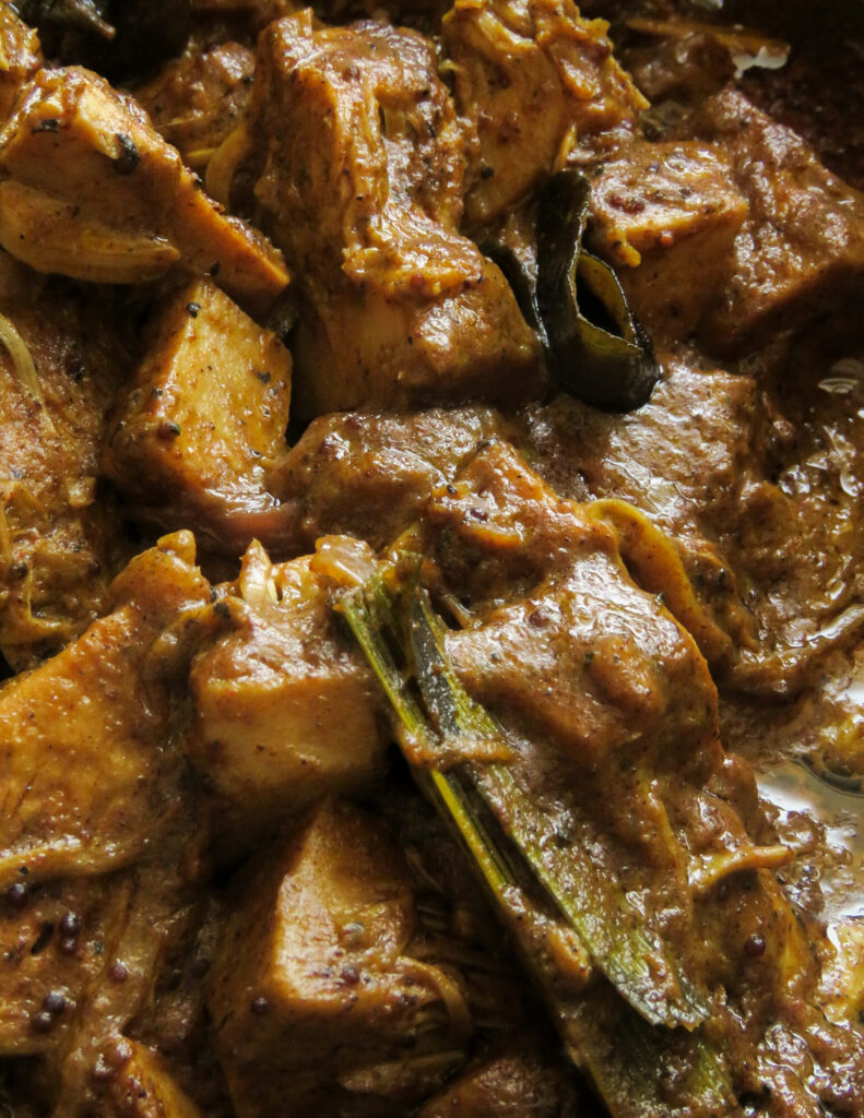 baby jackfruit curry with curry leaves and spices.